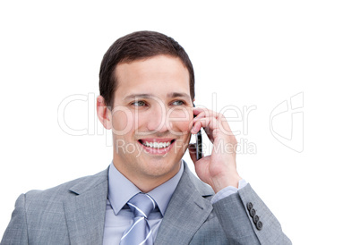 Portrait of a lucky businessman on phone