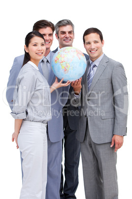 Successful businessteam looking at a terrestrial globe