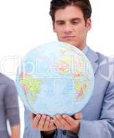 Portrait of a confident man holding a terrestrial globe