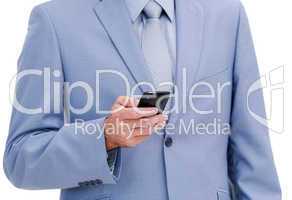 Close-up of a young businessman looking at his phone
