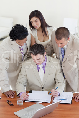 International business people studying a document