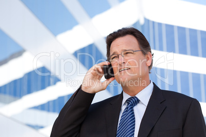 Businessman Smiles as He Talks on His Cell Phone