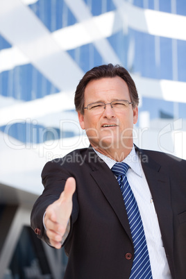 Businessman Outdoors Holds Out His Hand To Shake