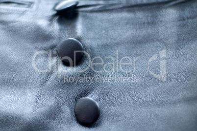 Three buttons on a leather