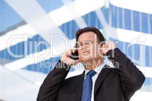 Excited Businessman on Cell Phone