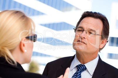 Businessman Talking with Female Colleague