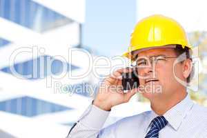 Contractor in Hardhat and Necktie Talks on His Cell Phone