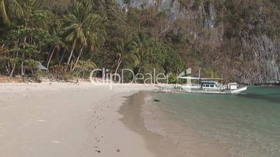 Tropical beach and boat near El Nido