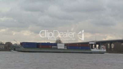 container ship moves through river
