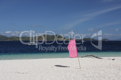 Flag on tropical beach