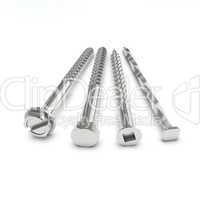 Four stainless steel fasteners on white floor