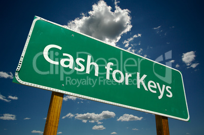 Cash for Keys Green Road Sign Over Clouds