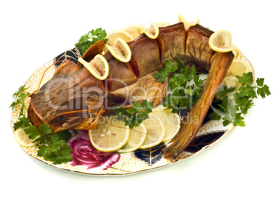 Bloated sheatfish with lemon and parsley