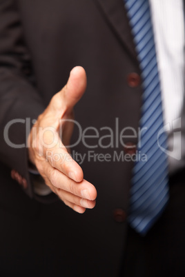 Businessman Reaching Out for Handshake