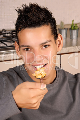 Young man eating cornflakes