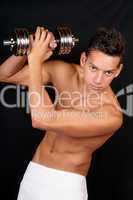 Young man with dumbbell