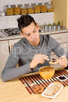 Young man having breakfast
