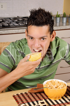 Young man having breakfast