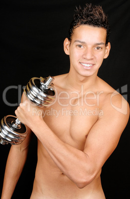 Young man with dumbbell