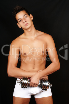 Young man with dumbbell