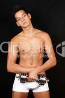 Young man with dumbbell