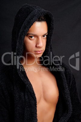 Young man with black bathrobe