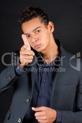 Young business man pointing at camera