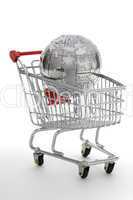 Metal puzzle globe with shopping cart, isolated on white background