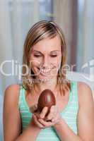 Smiling woman holding an easter egg