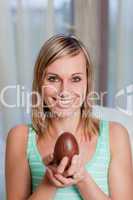 Beautiful woman holding an easter egg