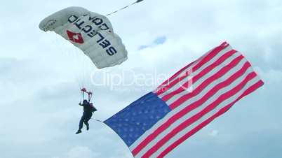 Skydiver Parachuting With Flag