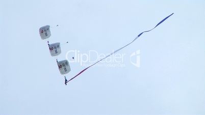 Skydivers Parachuting In Formation