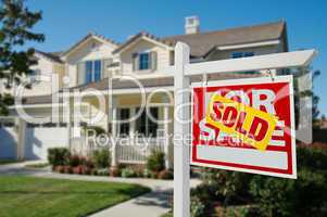 Sold Real Estate Sign and House