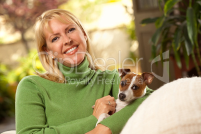 Woman and Puppy Enjoying Their Day on The Sofa