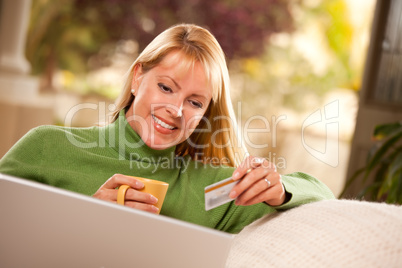 Beautiful Woman with Credit Card Using Laptop