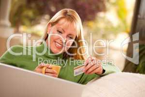 Beautiful Woman with Credit Card Using Laptop