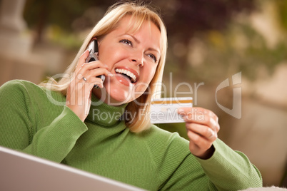 Cheerful Woman on Phone and Laptop with Credit Card