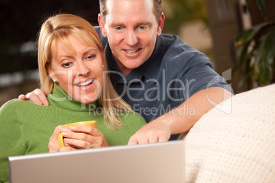 Handsome Couple Using Laptop