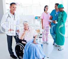 Positive medical team taking care of a senior woman