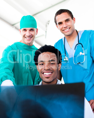 Hopeful male doctors looking at X-Ray