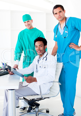 Assertive male doctors looking at X-Ray