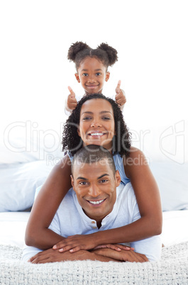 Adorable little girl having fun with her parents