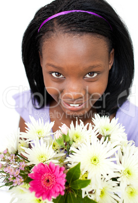 Attractive Afro-american woman holding flowers