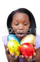 Joyful woman holding colorful Easter eggs