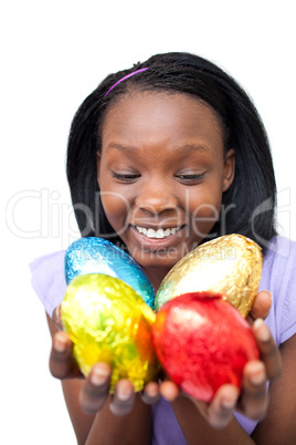 Cheerful woman holding colorful Easter eggs