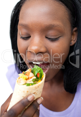 Afro-american woman eating a wrap