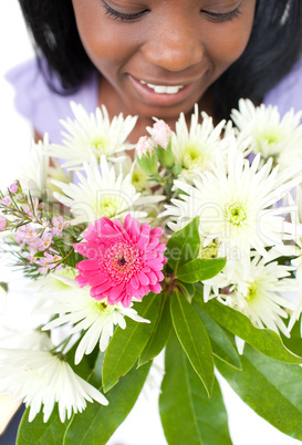 Close-up of a smiling woman holding flowers