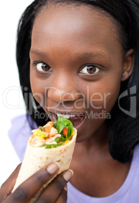 Young woman eating a wrap