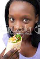 Young woman eating a wrap