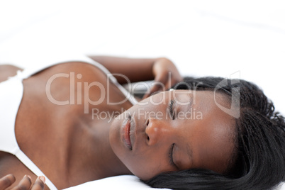 Relaxed woman sleeping lying on her bed